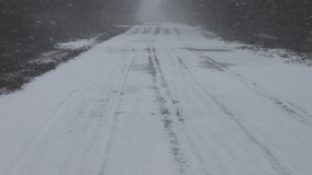 snowfall covers the road, slow motion video