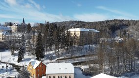 Tanvald on sunny winter day, Jizera Mountains, Czech Republic. Aerial 4K footage from drone flight