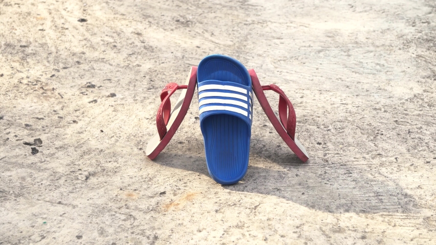 Temanggung, Indonesia - September 2022 : close up of children playing flip-flops with feet on the background. Perfect for background, film, documentation, education, ect.