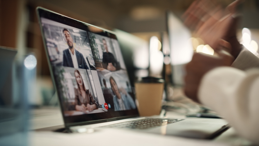 Multiethnic People Conference Meeting Online and Discussing Business Projects. Laptop Screen Group Video Call. Colleagues Working From Home and Collaborating on Internet. Remote Hybrid Work. Close-up Royalty-Free Stock Footage #1096559067
