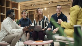 Group of People from Multiple Ethnicities Working on Problem Solving Using Notes, Laptop and Tablet in a Meeting Room at the Office. Teammates Giving Constructive Feedback on Eachother's Projects - Powered by Shutterstock - Get 15% off with code: PIKWIZARD15
