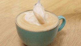 Close up footage of creamy and tasty fresh cup of cappuccino