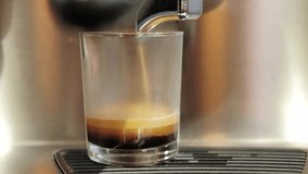 Close up video of making fresh glass cup coffee at coffee machine in cafe