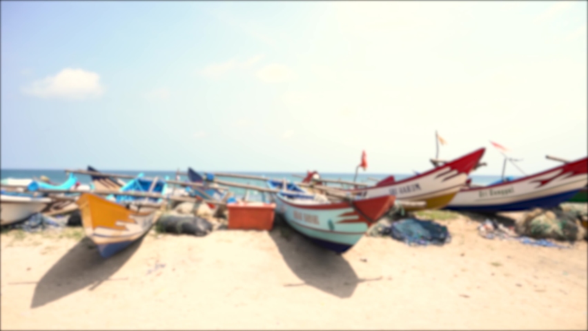 Yogyakarta, Indonesia - November 2022 : Blur video shows the boat leaning on the beach. Perfect for background, film, documentation, education, ect.
