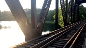 An old railroad that goes over a bridge. - Powered by Shutterstock - Get 15% off with code: PIKWIZARD15