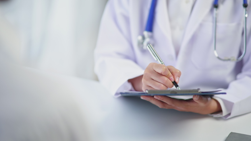 Close up of doctor's hands consult and treatment to patient then explaining and advising about using pills medicine and 
