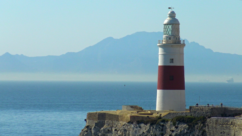 Lighthouse of Punta Europa, over the cliffs of the seashore of Gibraltar. Royalty-Free Stock Footage #1096573073
