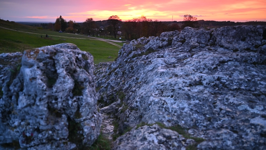 Limestone rocks against the backdrop of a strongly colored sunset sky