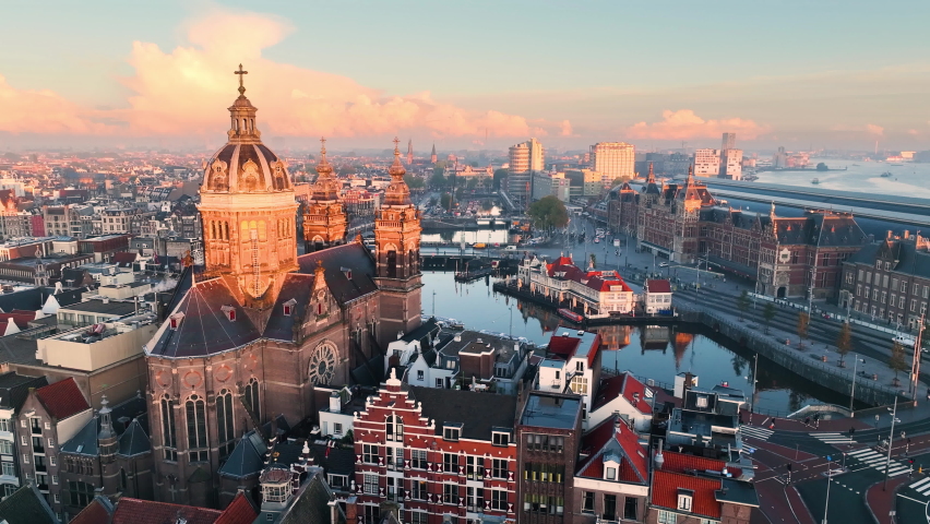 Aerial view of famous places Amsterdam, Netherlands. View of canal and old centre district. railway station Amsterdam Centraal