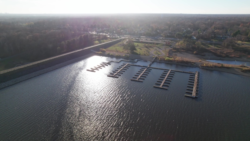 Empty wooden harbor at lake and reservoir that has no boats, ships, or recreational vehicles docked at a Midwestern Ohio town
