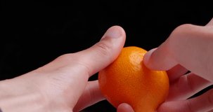 4K video of mandarin orange peeling.