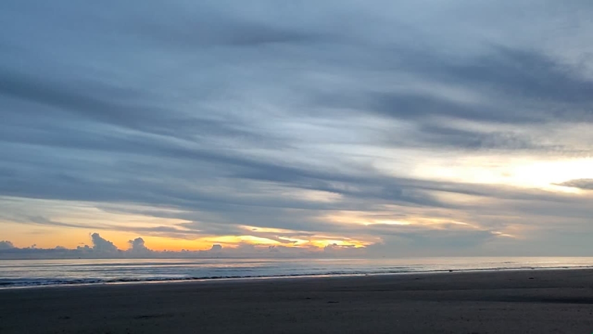timelapse morning on the beach with beautiful clouds