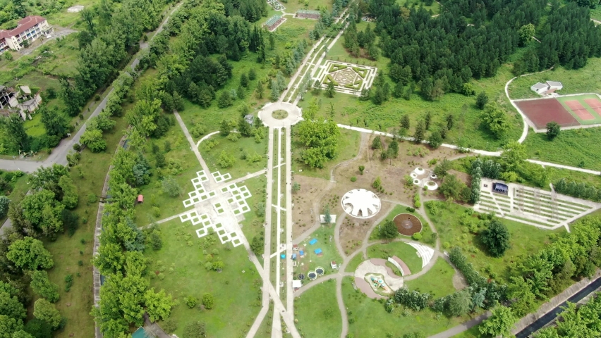 Massive park with pathways and roundabout in Georgia, aerial drone view