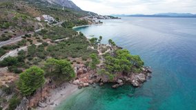 Aerial drone video Beautiful beach near Brela town, Dalmatia, Croatia. Makarska riviera, famous landmark and travel touristic destination in Europe
