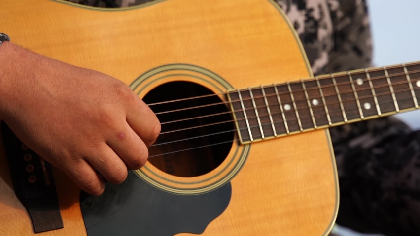 Close up man's hand playing the guitar Royalty-Free Stock Footage #1096609509