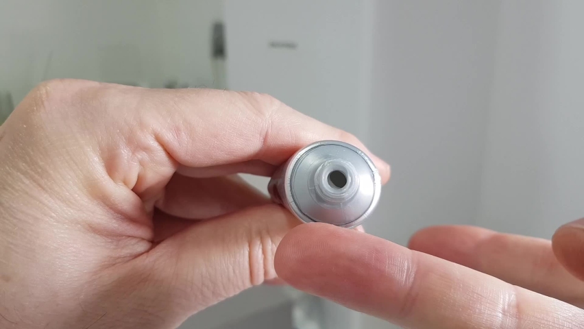 Output of an ointment packaged in an aluminum tube