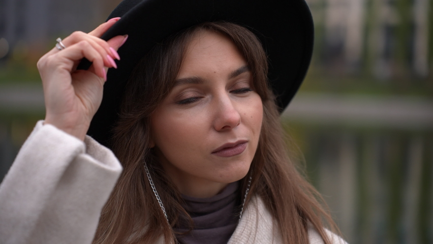 Portrait of a beautiful young girl in a hat