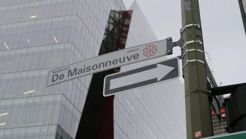 Directional Street Signage On A Signpost In Boulevard de Maisonneuve, Quebec City, Canada. low angle