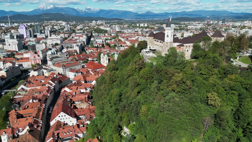 Ljubljana city centre and castle in Slovenia panning drone aerial view Royalty-Free Stock Footage #1096619485