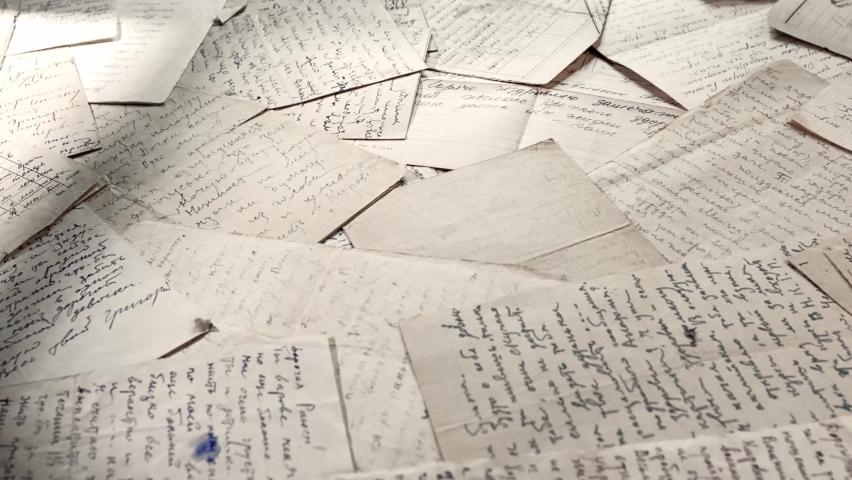 Table covered with many old letters. Left to right panoramic rotation with selective focus | Shutterstock HD Video #1096621865