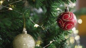 Animation of feliz navidad christmas greetings text over christmas tree. Christmas, tradition, celebration and festivity concept digitally generated video. - Powered by Shutterstock - Get 15% off with code: PIKWIZARD15