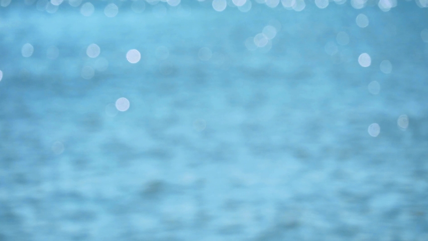 Blur and bokeh reflection bigger glitter of sun light on the sea in the summer season Royalty-Free Stock Footage #1096668651