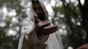 Jesus Christ takes the hand of a young man to help them stand up - Powered by Shutterstock - Get 15% off with code: PIKWIZARD15