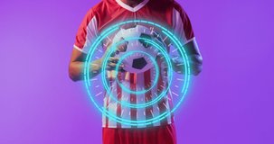 Animation of african american male soccer player over scope scanning. Global sport and digital interface concept digitally generated video.
