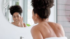 Woman, skincare and bathroom mirror face check in home, house or hotel grooming, acne treatment or dermatology success. Smile, happy and Brazilian beauty model wellness health or self care management - Powered by Shutterstock - Get 15% off with code: PIKWIZARD15