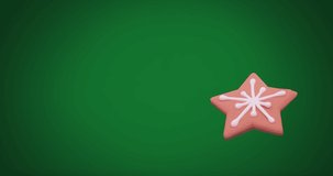 Animation of christmas star gingerbread cookie with copy space on green background. Christmas, festivity, tradition and celebration concept digitally generated video.