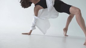 Curly-haired girl dances contemporary. Dynamic dance video