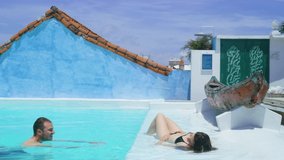 Lovely couple in swimming pool on their vacation in cartagena. - Powered by Shutterstock - Get 15% off with code: PIKWIZARD15