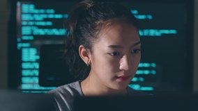 Young Asian woman, developer programmer, software engineer, IT support, working hard at night overtime on computer to check coding in bugging system  - Powered by Shutterstock - Get 15% off with code: PIKWIZARD15