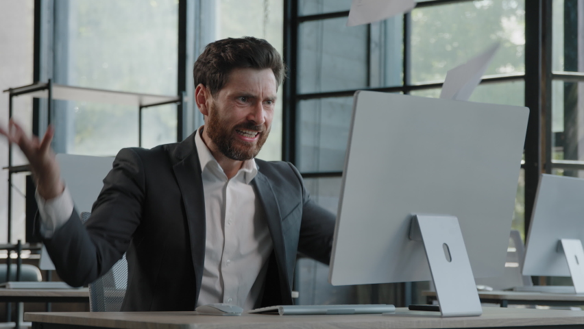 Sad upset mad crazy failure adult bearded Caucasian man in office work angry businessman tired worker problem with paperwork stress with documents mistake deadline trouble with work throwing papers | Shutterstock HD Video #1096684537