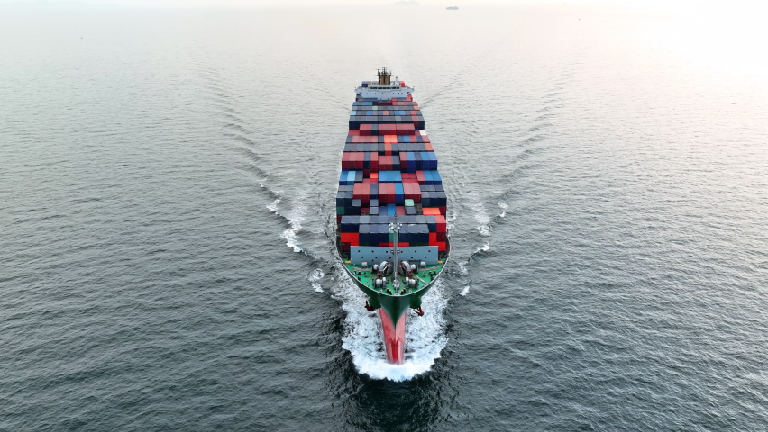 Cargo container Ship, cargo maritime ship with contrail in the ocean ship carrying container and running for export  concept technology freight shipping sea freight by Express Ship. front view 