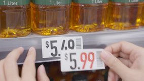 Rising prices cost of living interest rate tax raise crisis concept. Global CPI index data number surge up high in grocer market by cooking oil food supply chain issues at retail store grocery mall. - Powered by Shutterstock - Get 15% off with code: PIKWIZARD15