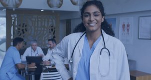 Animation of media icons over diverse doctors talking. Global medicine and digital interface concept digitally generated video.