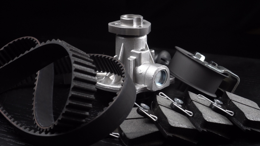 Auto parts spare parts car on grey background. Large number rotate on turntable around its axis. Auto parts store. Suspension and engine parts. Royalty-Free Stock Footage #1096697105