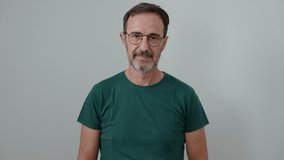 Middle age man standing with arms crossed gesture over isolated white background - Powered by Shutterstock - Get 15% off with code: PIKWIZARD15