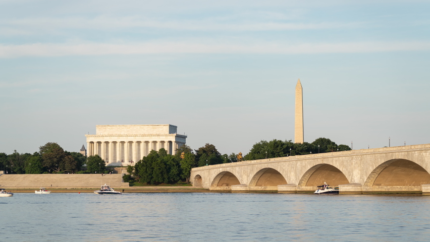 A 4k sunset time lapse of the Arlington Memorial Bridge, Washington Memorial, Lincoln Memorial, and the Potomac River during a busy summer evening. 