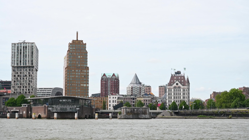 Rotterdam, Netherlands: Panoramic view of skyscrapers in city. Buildings in Rotterdam. Nieuwe Maas which is a northern distributary of the Rhine River.