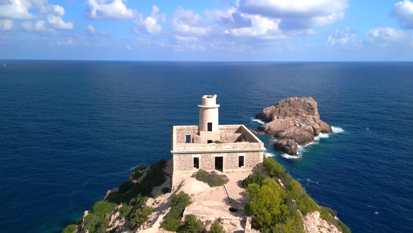 view sky clouds lighthouse ruin ibiza spain. Gorgeous aerial view flight