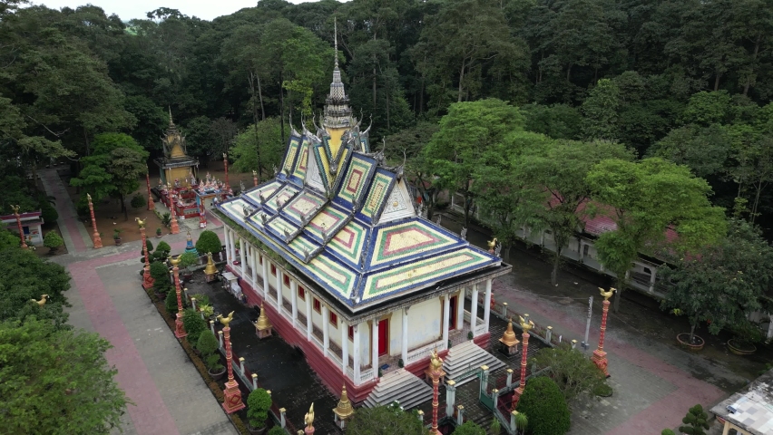 Aerial drone footage over Hang Pagoda in Tra Vinh province. Numerous Khmer ancient pagodas can be found in this are. Here camera is moving foward the stunning construction. 2-2