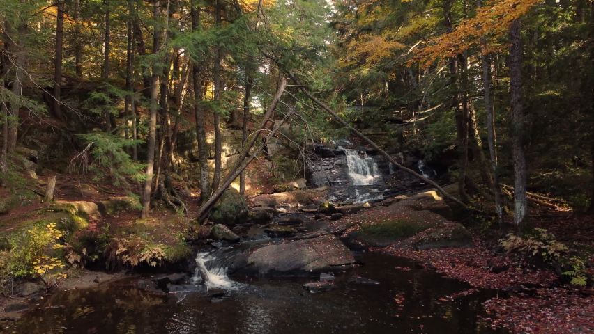 Ascending On Mountain River And Autumn Forest Trees At Algonquin Provincial Park In Southeastern Ontario, Canada. Aerial Drone