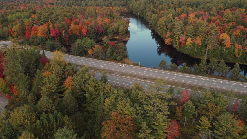 Traffic Along The Highway In Algonquin Provincial Park, Muskoka Region, Ontario Canada. Aerial Shot