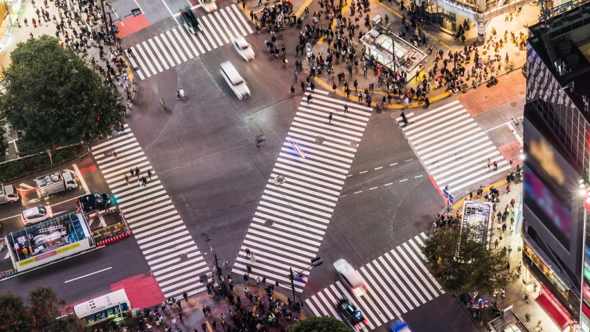 Night time lapse of car traffic transportation, crowded people walk cross road at Shibuya scramble crossing. Tokyo tourist attraction landmark, Japan tourism, Asia transport or Asian city life concept Royalty-Free Stock Footage #1096715037