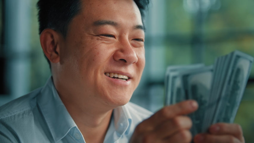 Close up asian korean man wealthy rich businessman banker investor successful male professional employee counting dollars exchange currency money banknotes win monetary prize invest in banking deposit Royalty-Free Stock Footage #1096722089