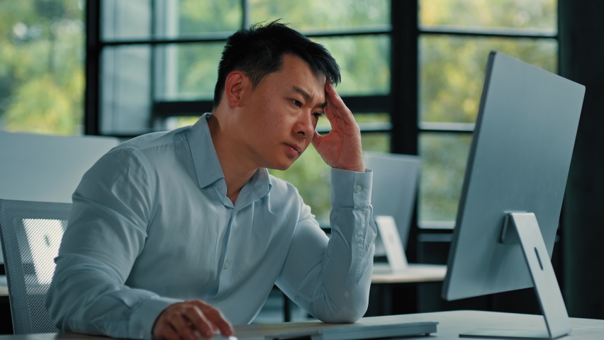 Asian businessman korean man work online at workplace difficult hard job get incorrect error in computer failure business problem. Upset anxious male disappointed about mistake bad internet in office Royalty-Free Stock Footage #1096722101