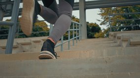 Close up female sporty legs running fitness girl jogger runner climbing upstairs training cardio workout in morning sunny day. Fit athletic sportswoman exercising on steps outdoors sprinting endurance - Powered by Shutterstock - Get 15% off with code: PIKWIZARD15