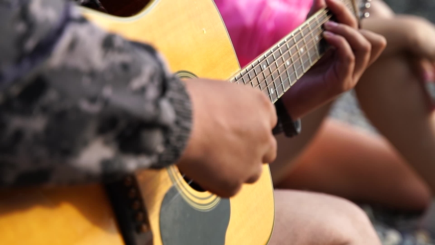 Close up man's hand playing the guitar Royalty-Free Stock Footage #1096722803